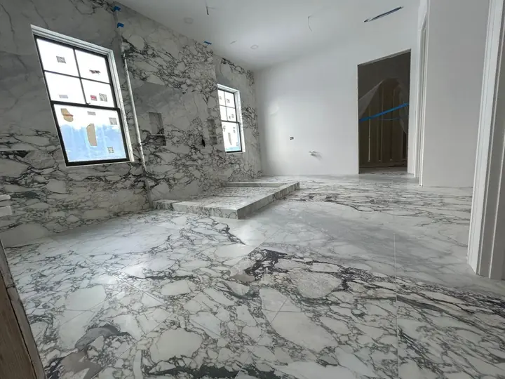 The same marble-style bathroom from the doorway